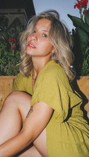 a woman sitting on a bench