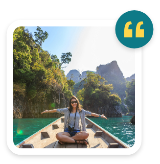 a woman sitting on a boat with her arms out