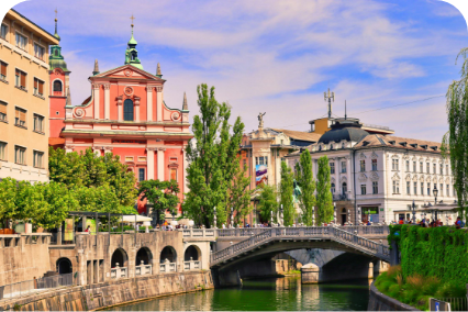 a bridge over a river with buildings in the background
