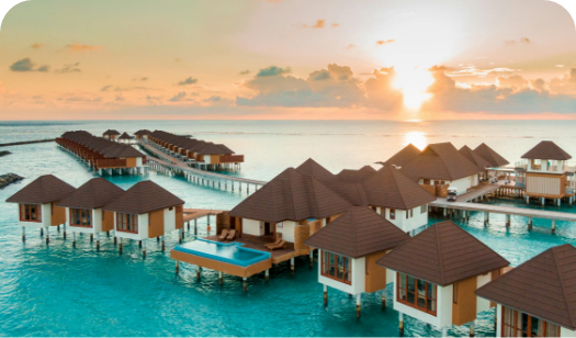 a group of houses on stilts in water