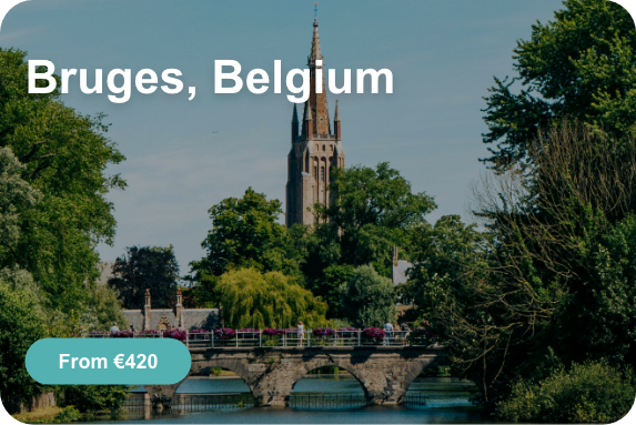 a bridge over a river with a tower in the background