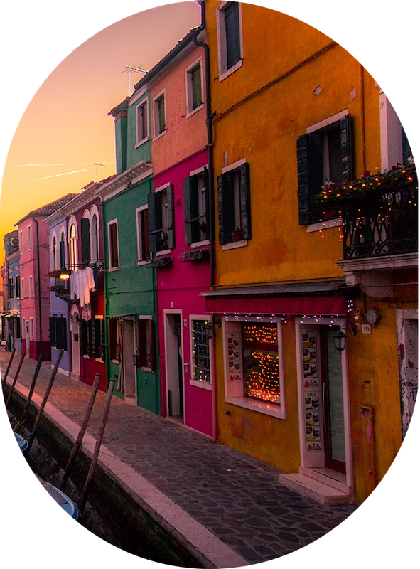 a colorful buildings along a canal