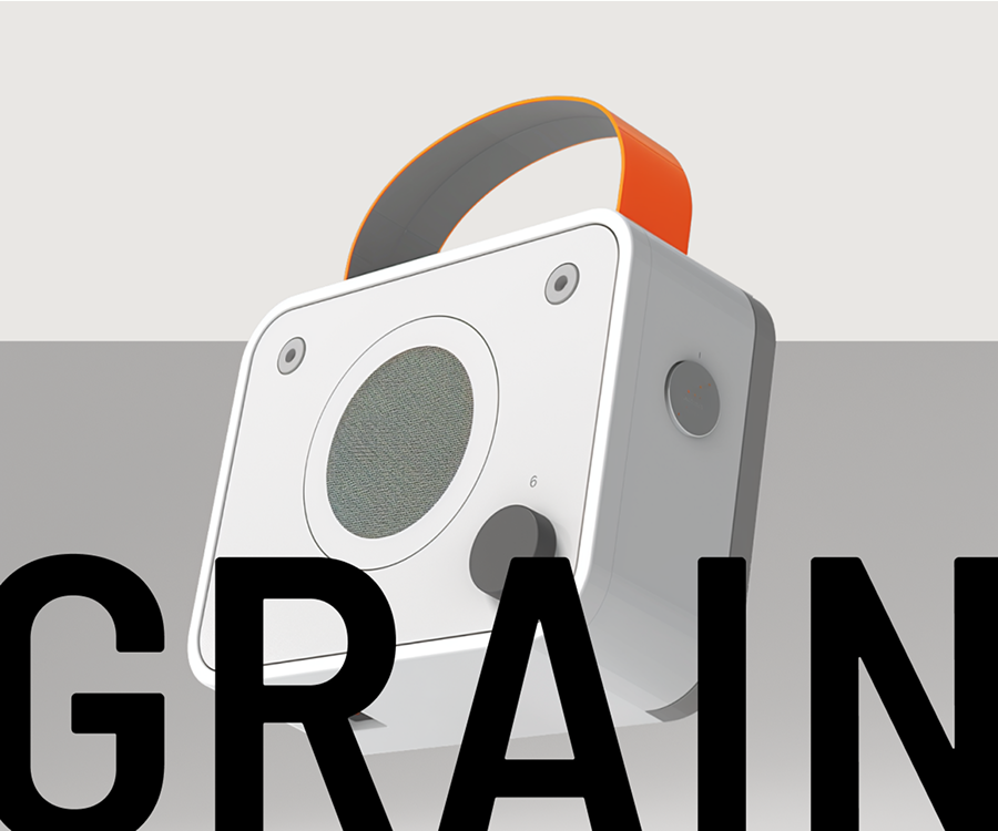 a white square speaker with orange strap