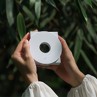 a person holding a white box
