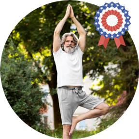 a man standing on one leg with his hands up