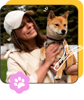 a woman holding a dog