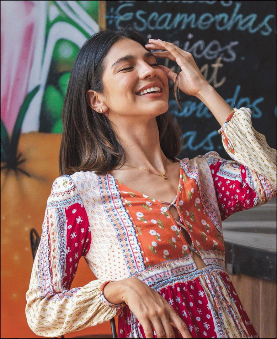 a woman with her hand on her face