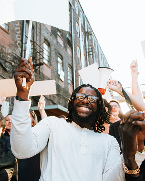a group of people holding signs