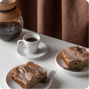 a plate of food and a cup of coffee