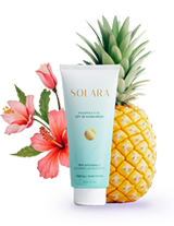 a bottle of sunscreen with flowers and pineapple