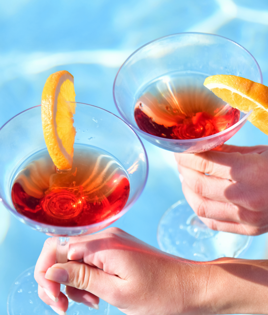 a pair of hands holding a drink