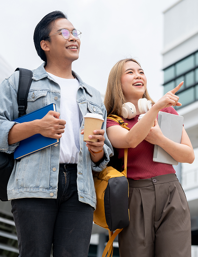a man and woman holding books and a cup of coffee
