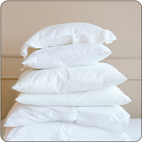 a stack of white pillows