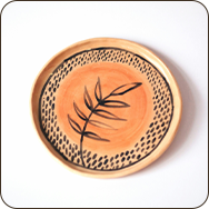 a plate with a leaf design