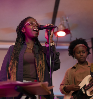 a woman singing into a microphone