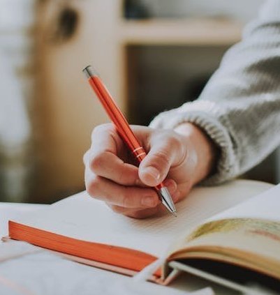 Hand and book