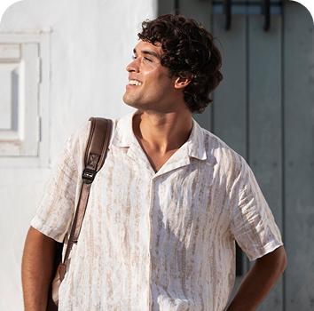 a man with a backpack smiling