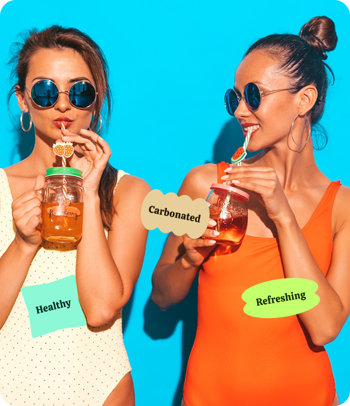 two women drinking from a mason jar