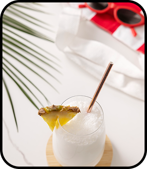a drink with a straw and pineapple on top