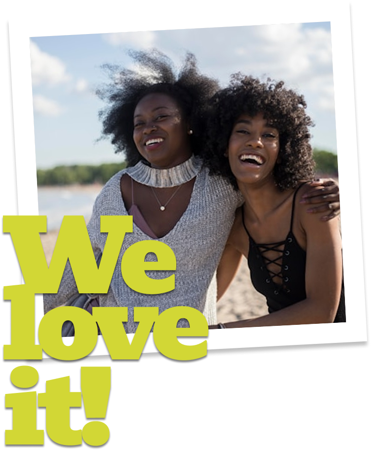 two women smiling at the camera