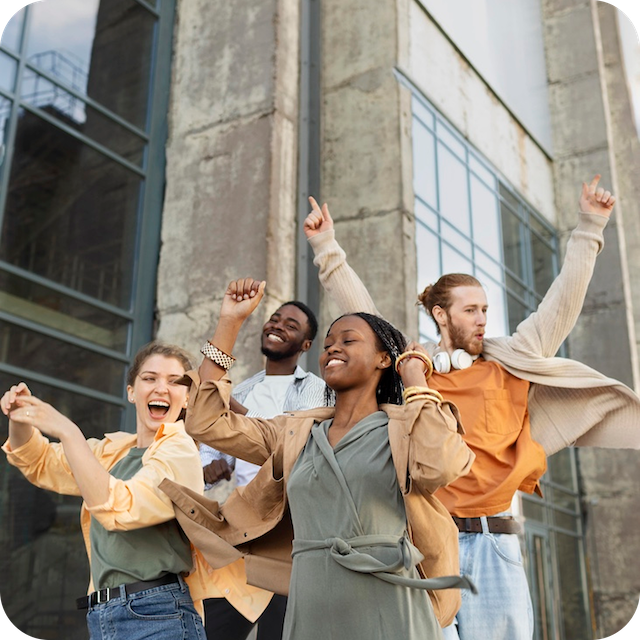 a group of people standing in front of a building