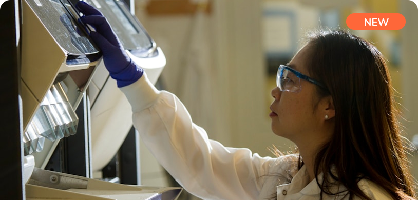 a woman wearing blue gloves and white coat