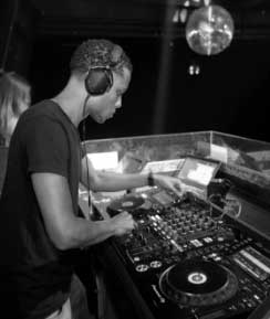 a man wearing headphones and playing music