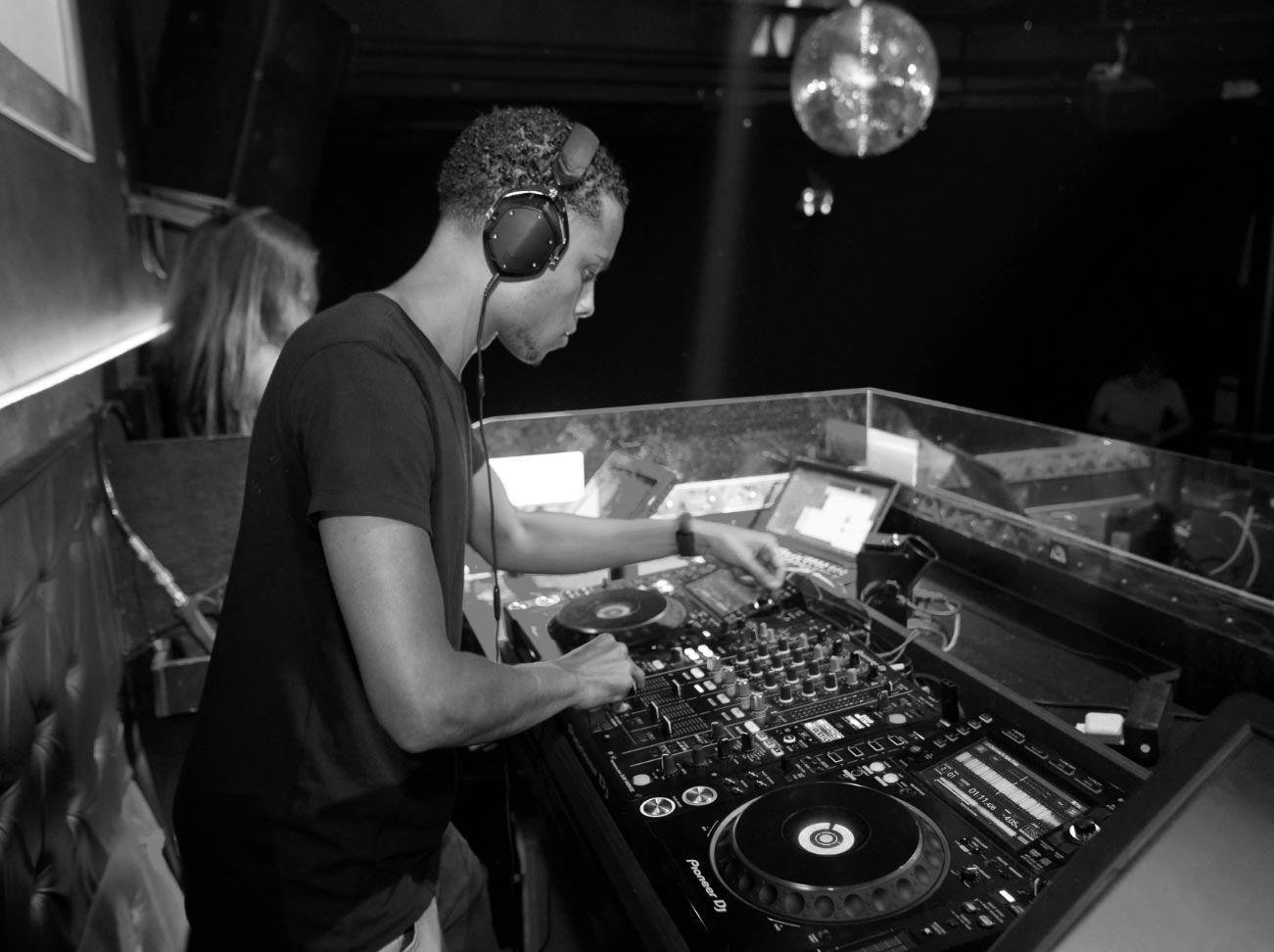 a man wearing headphones and playing music