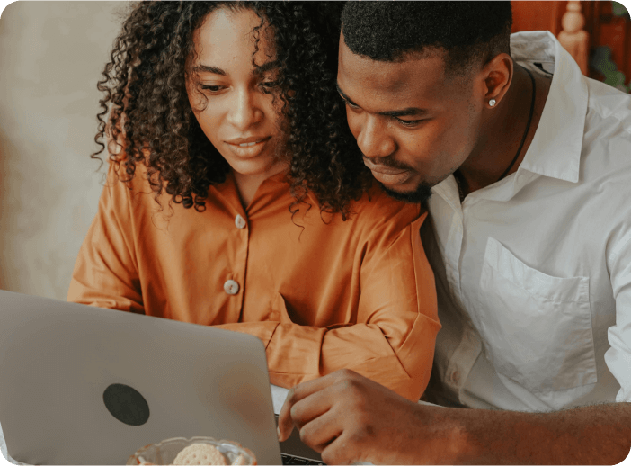 a man and woman looking at papers