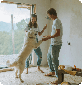 a man and woman holding a dog