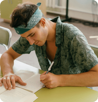 a man writing on a book