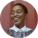 a woman smiling with closed eyes