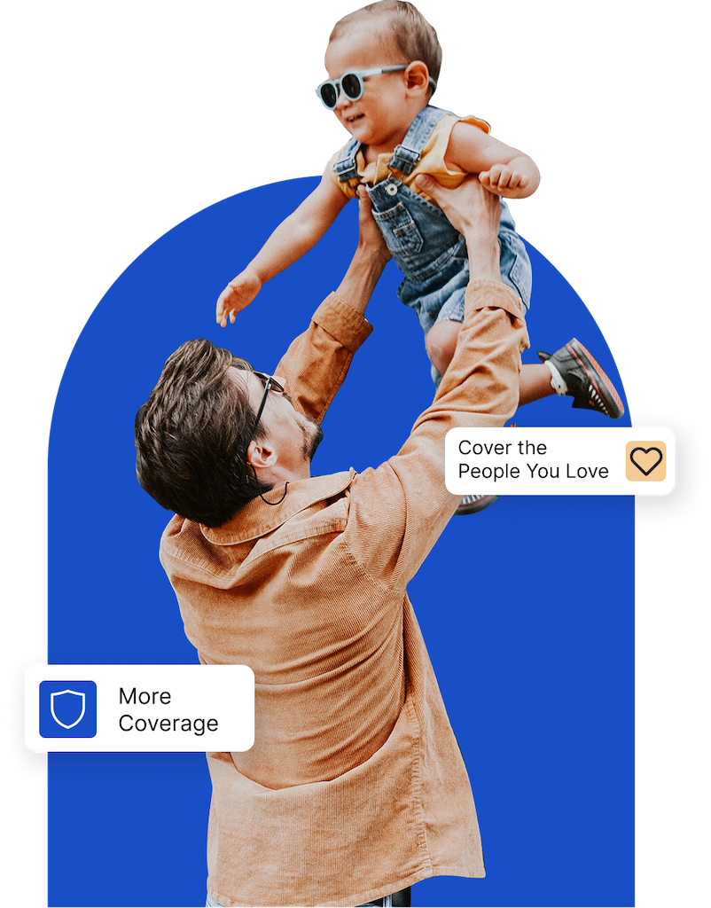 a man and woman sitting on a couch with a child