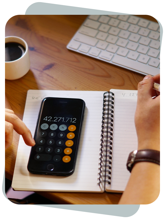 a person using a calculator on a notebook